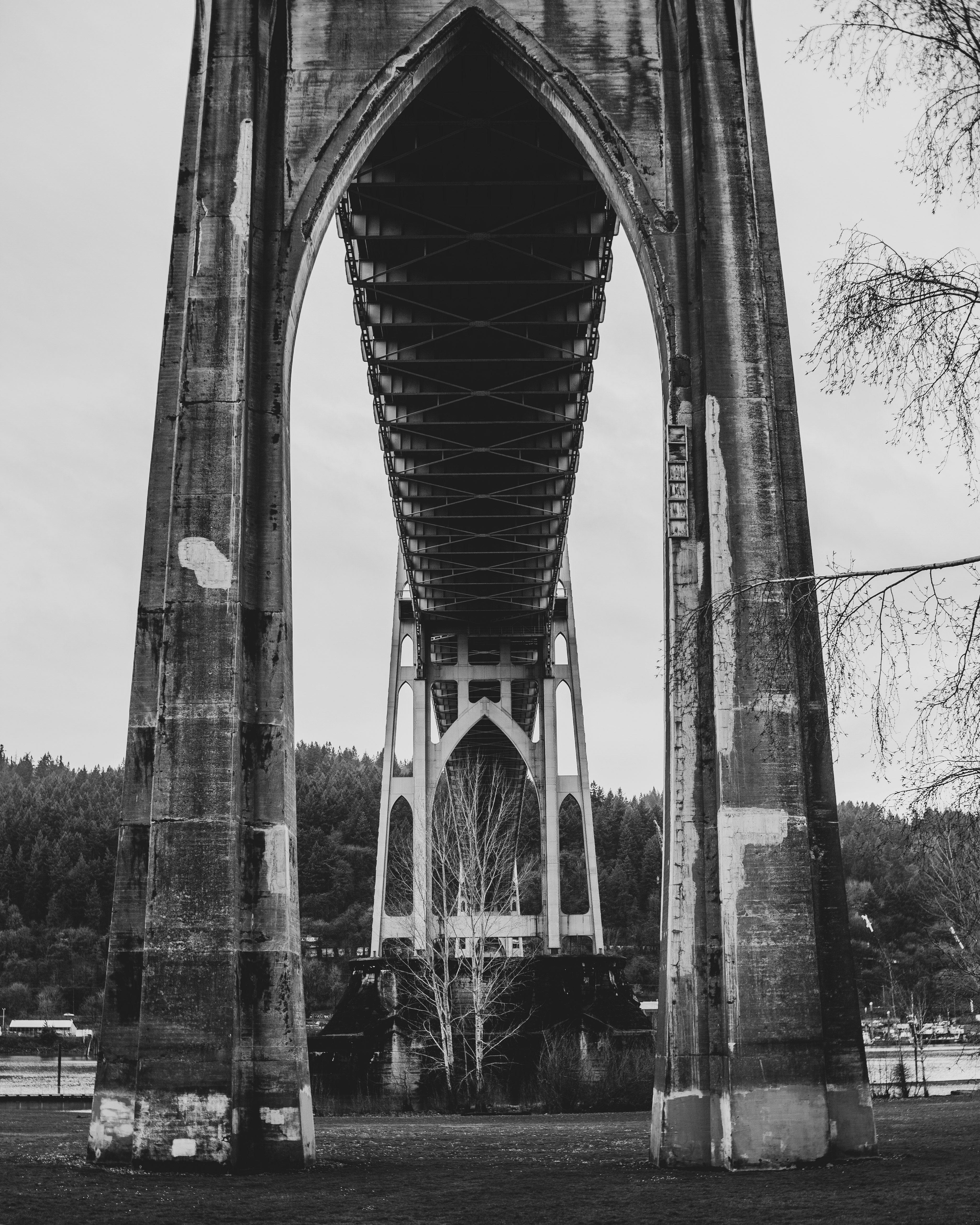 grayscale photo of concrete bridge